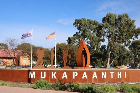 The artwork features a ceremonial flame and three figures – a traditional Kaurna warrior, a soldier representing World Wars I and II, and a modern-day soldier, to remember and acknowledge Kaurna people who have served Australia both past and present.