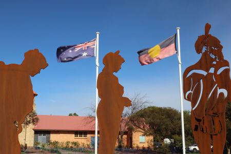 The artwork features a ceremonial flame and three figures – a traditional Kaurna warrior, a soldier representing World Wars I and II, and a modern-day soldier, to remember and acknowledge Kaurna people who have served Australia both past and present.
