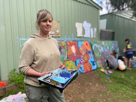Fran Cullen with her Grey Box Grassy Woodland Mural