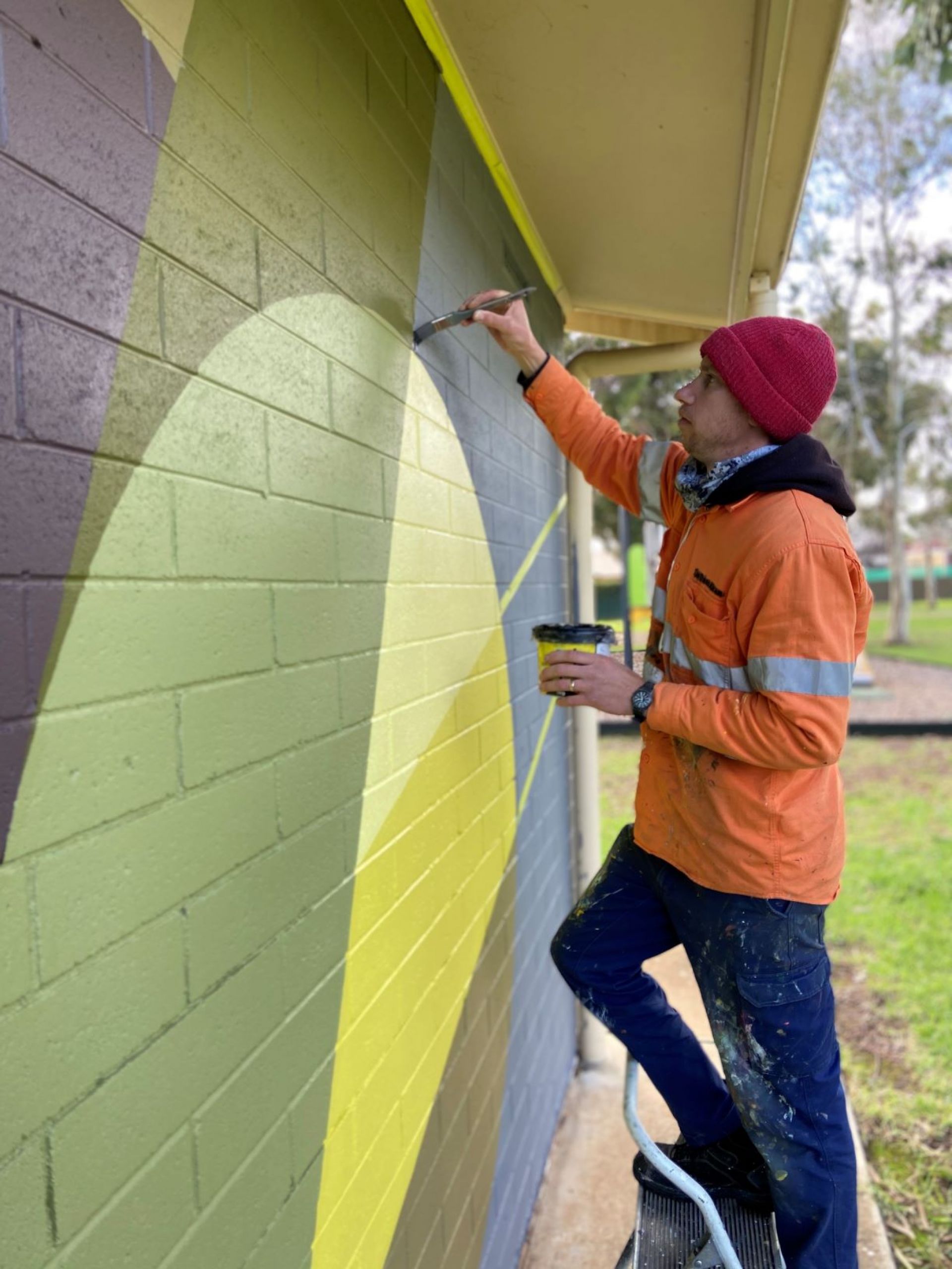Artist Matt Fortrose paints a mural at Pasadena