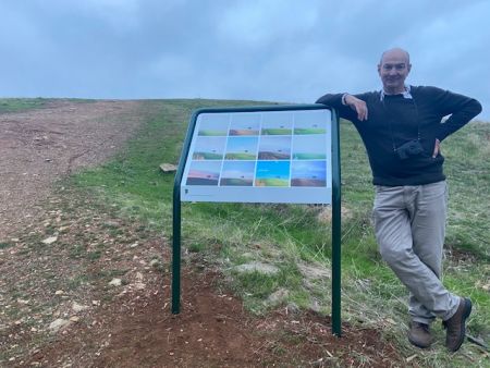 Artist David Hume with his Photography Art Installation that captured the lone tree atop Brown Hill across seasons.