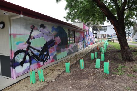 North wall – facing the skate park This side of the mural pulses with energy, featuring BMX riders, skaters and bold graffiti-inspired design. It reflects the movement, creativity and street culture of the local skate community.